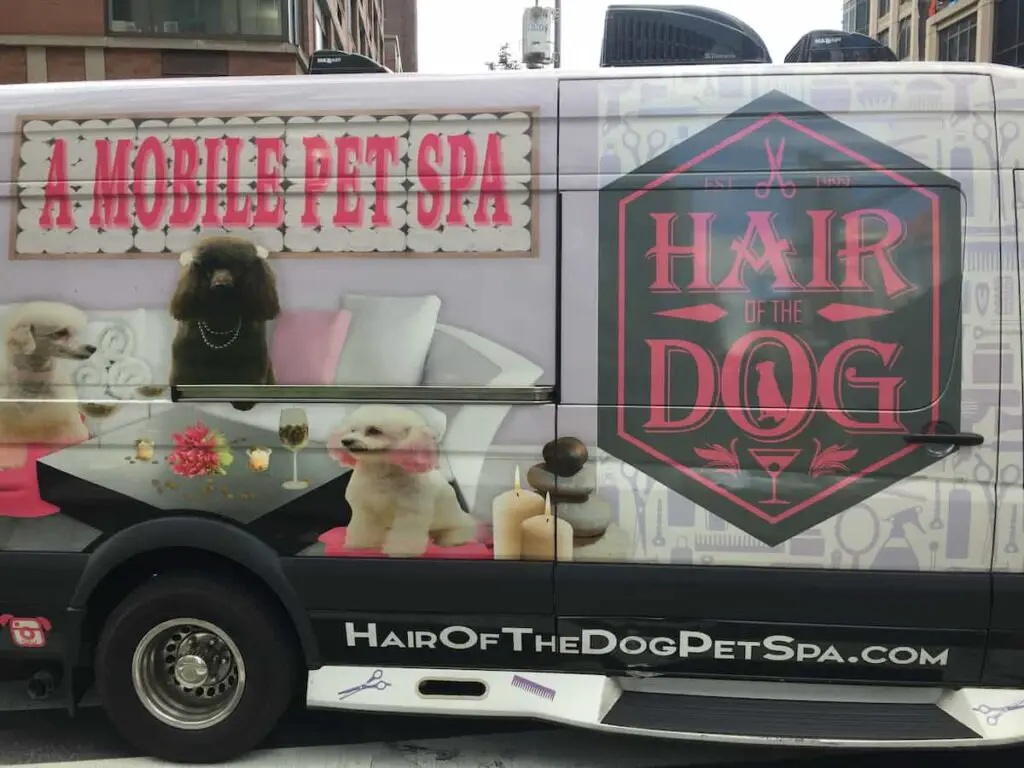 Closeup of a mobile dog grooming services van.