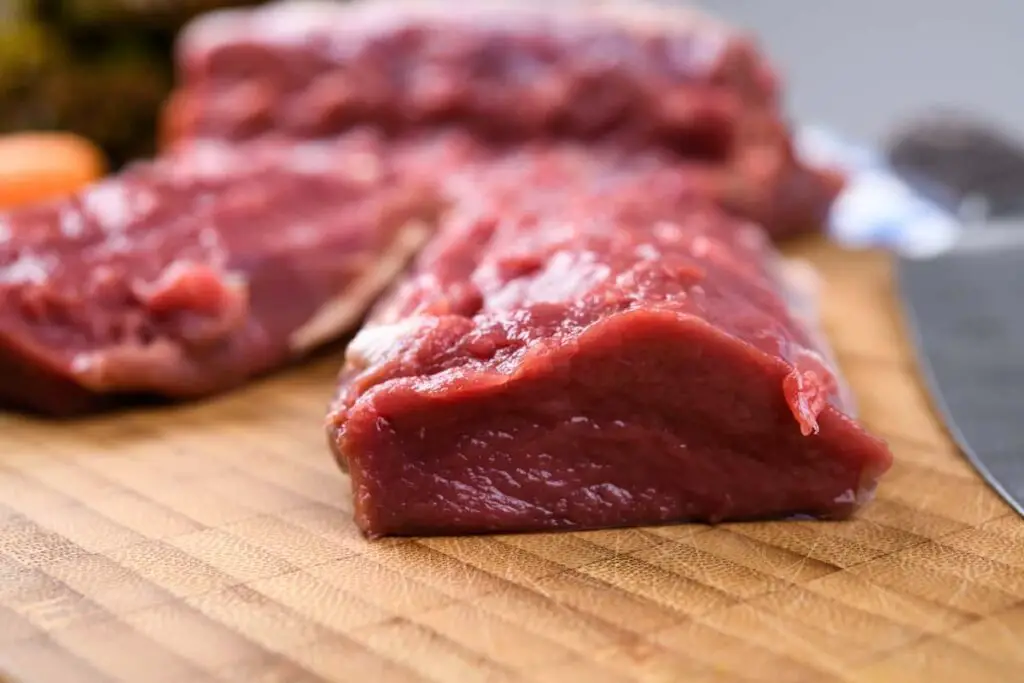 Raw cuts of venison meat.